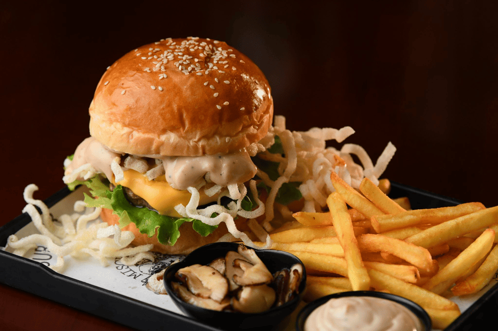 Burger at Mischief & Mayhem with succulent beef, cheese, bacon, and special sauce (Source: Mischief & Mayhem Burgers)